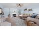 Comfortable living room featuring a fireplace, large sectional sofa, and stylish decor at 240 Daisy Cir, Mcdonough, GA 30252