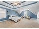 Bright main bedroom featuring tray ceiling, carpet, and a sitting area by the windows at 240 Daisy Cir, Mcdonough, GA 30252