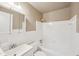 Clean bathroom with a white tiled shower and vanity at 2880 Shallowford Rd, Chamblee, GA 30341