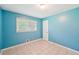 Bright bedroom with tile floors and a window at 2880 Shallowford Rd, Chamblee, GA 30341