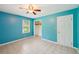 Bright bedroom with blue walls, tile floors, and a spacious closet at 2880 Shallowford Rd, Chamblee, GA 30341