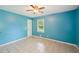 Bright bedroom featuring a ceiling fan, tile floors, and natural light from a window at 2880 Shallowford Rd, Chamblee, GA 30341