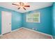 Bright bedroom with tile floors, ceiling fan, and a window providing natural light at 2880 Shallowford Rd, Chamblee, GA 30341