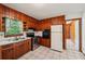 Functional kitchen with wood cabinetry, stainless steel appliances, and a bright window at 2880 Shallowford Rd, Chamblee, GA 30341