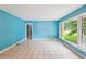 Inviting living room with abundant natural light, tile flooring, and a seamless flow into other areas at 2880 Shallowford Rd, Chamblee, GA 30341