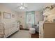 Charming Bedroom with natural light, cozy decor, including a glider, and a serene atmosphere at 9470 Hillside Dr, Roswell, GA 30076
