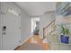 Inviting entryway with hardwood floors and view of staircase at 9470 Hillside Dr, Roswell, GA 30076