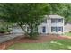 Traditional two-story home with white siding and blue shutters at 9470 Hillside Dr, Roswell, GA 30076