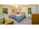 Bright bedroom with twin beds, warm lighting, and framed art work on the walls at 2518 Foster Ridge Ne Ct, Atlanta, GA 30345