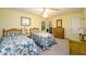 Bright bedroom with twin beds, warm lighting, closet storage, and framed art work at 2518 Foster Ridge Ne Ct, Atlanta, GA 30345