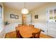 The dining area features hardwood floors, wainscotting, and a hanging lamp for a quaint setting at 2518 Foster Ridge Ne Ct, Atlanta, GA 30345
