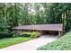 Brick ranch home with mature trees providing shade and a welcoming driveway at 2518 Foster Ridge Ne Ct, Atlanta, GA 30345