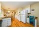 The eat-in kitchen area offers hardwood floors, granite counters, and white cabinets at 2518 Foster Ridge Ne Ct, Atlanta, GA 30345