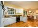 Functional kitchen with granite counters, hardwood floors, and adjacent dining area is ready for entertaining at 2518 Foster Ridge Ne Ct, Atlanta, GA 30345