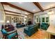 Comfortable living room with hardwood floors, built in shelves, and access to sunroom at 2518 Foster Ridge Ne Ct, Atlanta, GA 30345