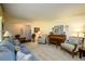 Spacious living room with comfortable seating, a piano, and neutral color scheme at 2518 Foster Ridge Ne Ct, Atlanta, GA 30345