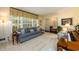 Bright living room with a large window, comfortable seating, and a decorative piano at 2518 Foster Ridge Ne Ct, Atlanta, GA 30345