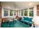 Relaxing sunroom featuring brick accent walls, ample natural light, and comfortable seating, a perfect retreat at 2518 Foster Ridge Ne Ct, Atlanta, GA 30345