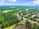 Aerial view of an idyllic, leafy suburb near a lake at 4526 Meadow Club Dr, Suwanee, GA 30024