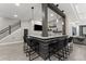 This entertainment area has a full bar with counter seating, modern stone backsplash and TV at 4526 Meadow Club Dr, Suwanee, GA 30024