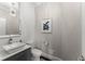 Bathroom with vessel sink, modern faucet, large mirror, and mosaic accent wall at 4526 Meadow Club Dr, Suwanee, GA 30024