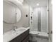 Modern bathroom with subway tile shower featuring a decorative accent stripe and a vessel sink at 4526 Meadow Club Dr, Suwanee, GA 30024