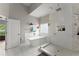 Bright bathroom features a modern soaking tub, large glass shower, and a window overlooking lush greenery at 4526 Meadow Club Dr, Suwanee, GA 30024