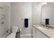 Modern bathroom featuring sleek fixtures, stylish tile floor, and glass-enclosed shower at 4526 Meadow Club Dr, Suwanee, GA 30024