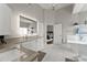 Luxurious bathroom with double vanity, sleek mirrors, and modern fixtures at 4526 Meadow Club Dr, Suwanee, GA 30024