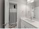 Clean bathroom with white cabinets and shower featuring black and white curtain at 4526 Meadow Club Dr, Suwanee, GA 30024