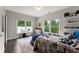 Cozy bedroom with wood floors and natural light at 4526 Meadow Club Dr, Suwanee, GA 30024