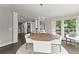 Cozy dining room with natural light, a stylish chandelier, and an open layout to other living spaces at 4526 Meadow Club Dr, Suwanee, GA 30024
