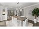 The dining area showcases an elegant chandelier, neutral walls, and dark hardwood flooring at 4526 Meadow Club Dr, Suwanee, GA 30024