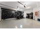 Spacious garage equipped with a golf cart, multiple bikes, and ample storage options at 4526 Meadow Club Dr, Suwanee, GA 30024
