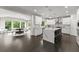 Open concept kitchen features stainless steel appliances, a large island, and ample counter space at 4526 Meadow Club Dr, Suwanee, GA 30024