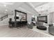 Modern living room with a bar, sleek furnishings, and a large screen for entertainment at 4526 Meadow Club Dr, Suwanee, GA 30024