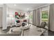 Bright living room featuring neutral décor, large windows, modern furniture, and stylish accents at 4526 Meadow Club Dr, Suwanee, GA 30024