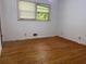 Bedroom with hard wood floors, good light, and neutral colored walls at 4701 Cleveland Rd, Lithonia, GA 30038