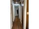 Hallway with wood flooring leading to the bedrooms and bathrooms at 4701 Cleveland Rd, Lithonia, GA 30038