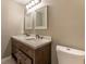 Bathroom featuring a double-sink vanity with marble countertop and dark wood drawers at 620 Waynes Se Ct, Atlanta, GA 30354