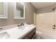 Bathroom featuring a vanity with marble countertop and a shower and tub combination at 620 Waynes Se Ct, Atlanta, GA 30354