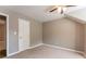 Bedroom featuring carpet, a ceiling fan, and access to another room at 620 Waynes Se Ct, Atlanta, GA 30354
