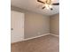 Bedroom featuring neutral walls, carpet, and a door with white trim at 620 Waynes Se Ct, Atlanta, GA 30354