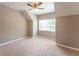 Bedroom showcasing plush carpet, neutral walls and ceiling fan with natural light at 620 Waynes Se Ct, Atlanta, GA 30354