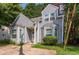 Charming home featuring a two-story facade, gray siding, bay windows, and a concrete driveway at 620 Waynes Se Ct, Atlanta, GA 30354