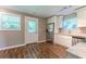 Kitchen featuring white cabinets, stainless steel appliances, granite countertops, and hardwood floors at 620 Waynes Se Ct, Atlanta, GA 30354