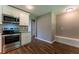 Kitchen featuring stainless steel appliances, hardwood floors, and bench seating at 620 Waynes Se Ct, Atlanta, GA 30354