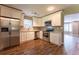 Kitchen featuring white cabinets, stainless steel appliances, granite countertops, and hardwood floors at 620 Waynes Se Ct, Atlanta, GA 30354