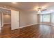 Spacious living room featuring wood-look floors, neutral paint, recessed lighting and a ceiling fan at 620 Waynes Se Ct, Atlanta, GA 30354