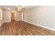 Spacious bedroom with wood-look floors and a view into the en suite bathroom at 620 Waynes Se Ct, Atlanta, GA 30354